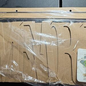 Chipboard Scrapbook Spells out "MEMORIES"